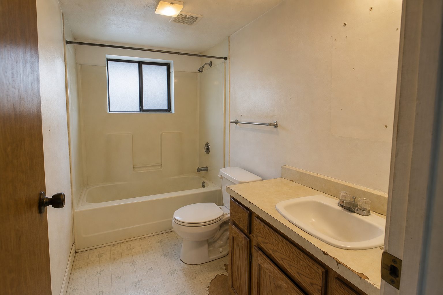 Before β dated bathroom updated with grab bars and slip-resistant surfaces